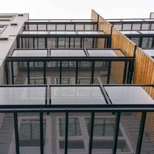 Custom mesh balconies and framed glass railings