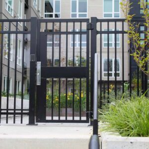 Vertical gate and pickets to a pool area of an apartment complex