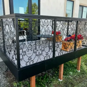 Custom ornate swirls on metal railing for balcony